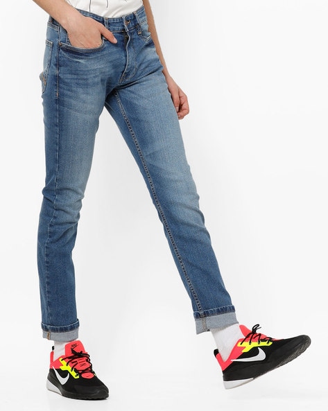 tapered fit mid rise jeans