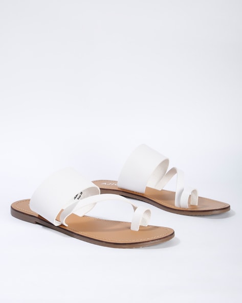 white flat slip on sandals