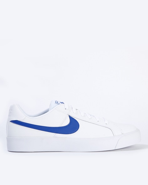 white nike shoes with blue tick