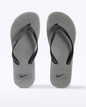 nike green flip flops