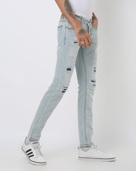 Low-Rise Skinny Fit Distressed Jeans (Image - 2)