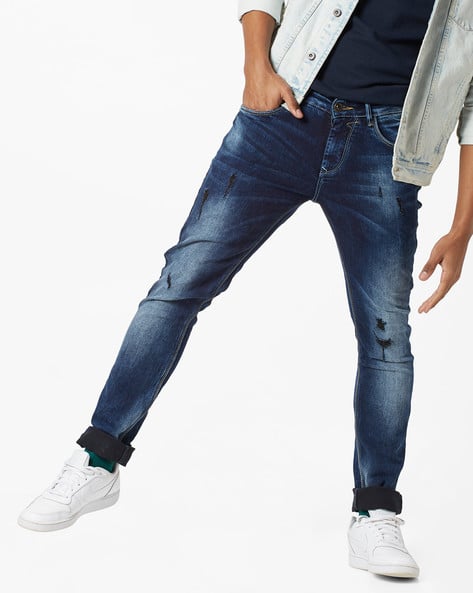 Skinny Fit Distressed Mid-Rise Jeans
