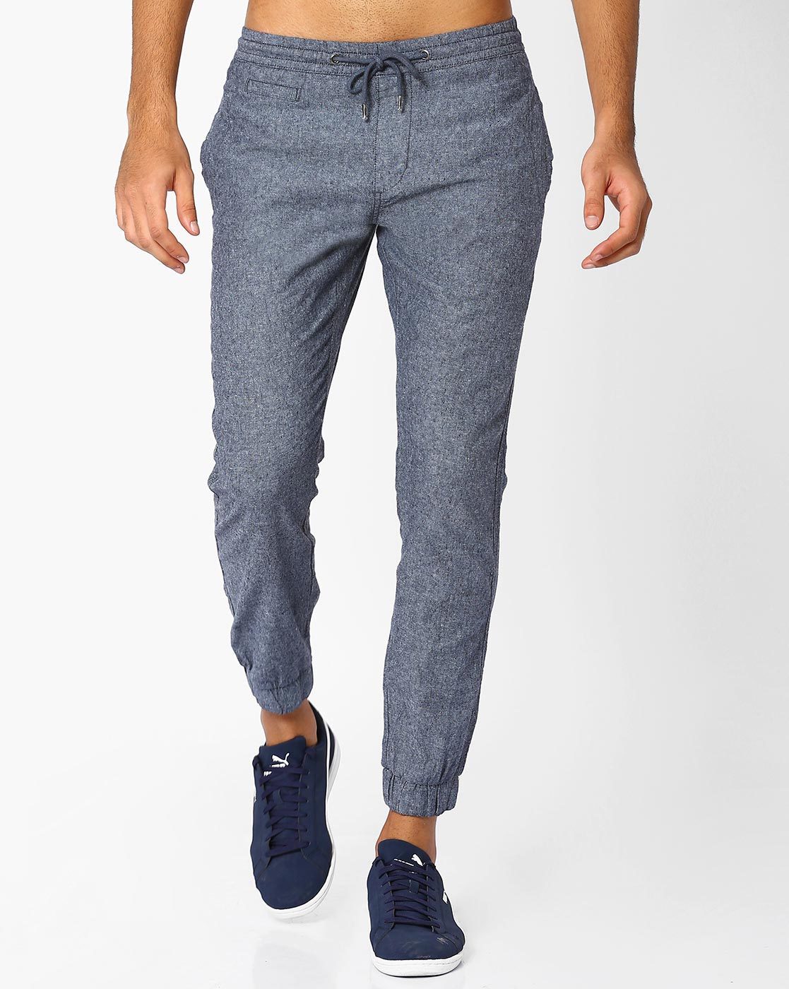 blue sweatpants with white stripe