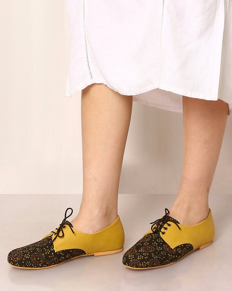 black and mustard shoes