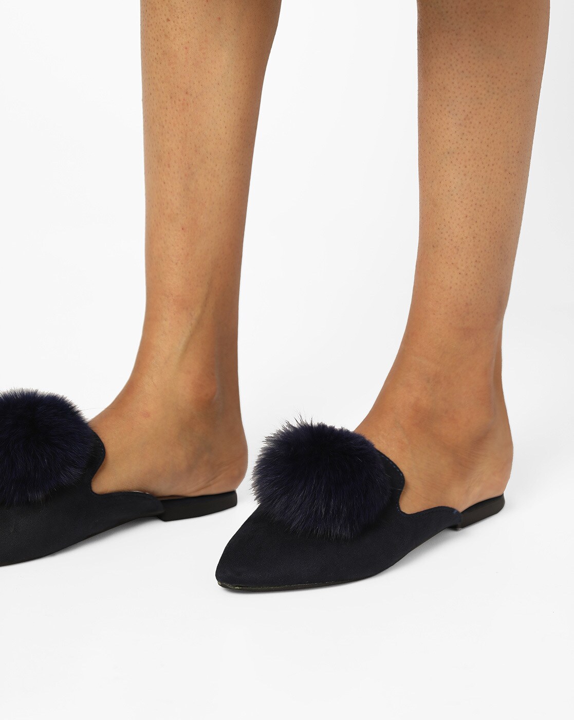 mules with pom poms