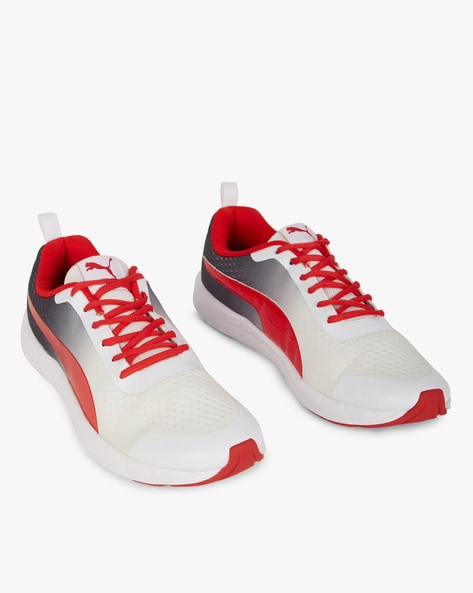 puma white and red sports shoes