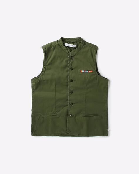 green sleeveless jacket