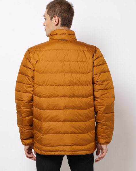 green puffer coat with orange lining