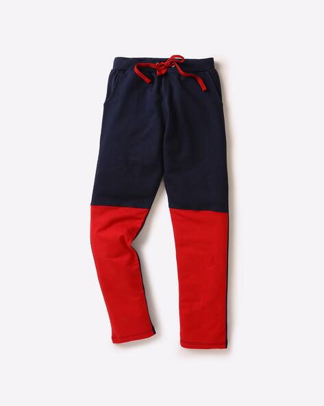 navy blue and red track pants
