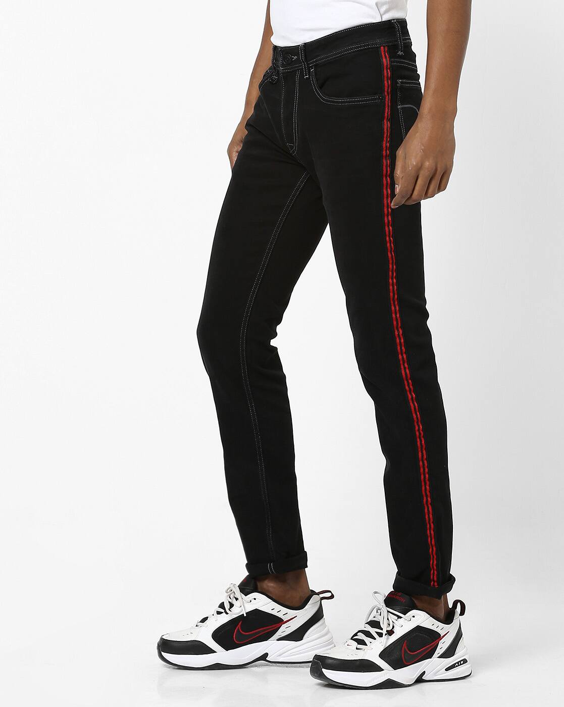 black jeans with stripes