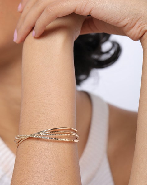 Tiffany T diamond hinged wire bangle in 18k white gold, medium. | Tiffany &  Co.