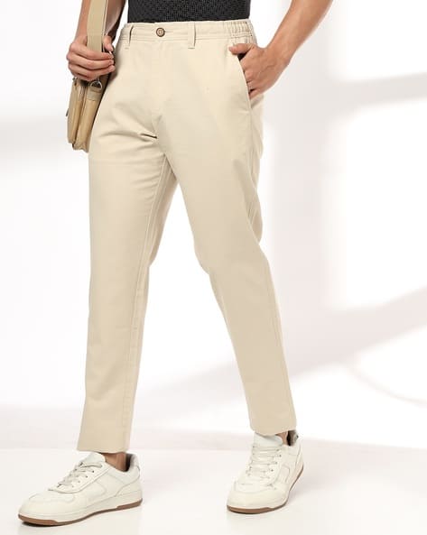 NETPLAY Men Slim Fit Flat-Front Trousers deal from ajio NETPLAY Men Slim Fit Flat-Front Trousers deal from ajio