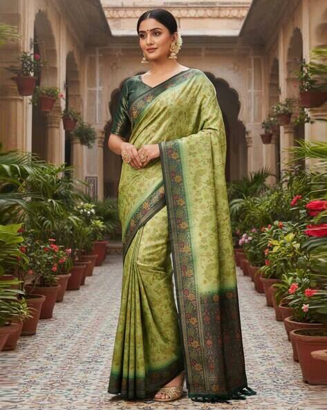 Nyrika Women Floral Woven Saree with Tassels