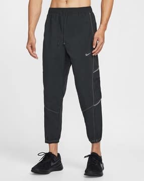 Buy NIKE Men Tech Woven Straight Track Pants Online | Ajio.com